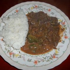 A picture of Spanish Liver served with Rice.