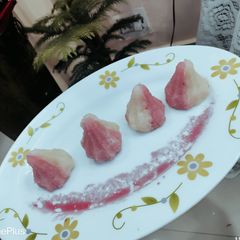 A picture of . Rose Coconut Modak.