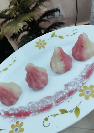 A picture of . Rose Coconut Modak.