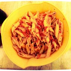 A picture of Pasta with tomatoes and and garlic.