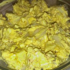 A picture of Deviled egg potato salad with bacon.