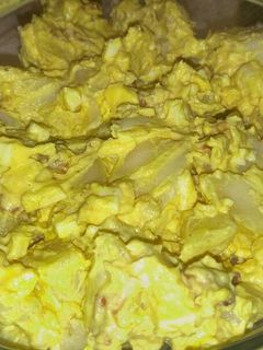 A picture of Deviled egg potato salad with bacon.