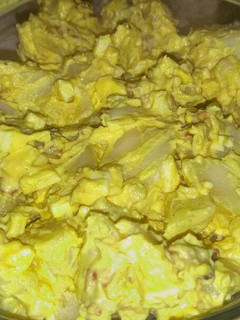A picture of Deviled egg potato salad with bacon.