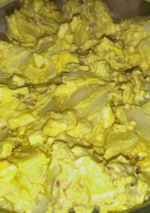 A picture of Deviled egg potato salad with bacon.