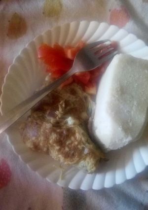A picture of Ugali and omellette.