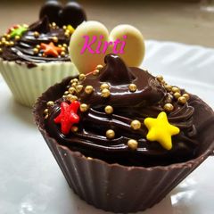 A picture of Chocolate mousse in chocolate cups.