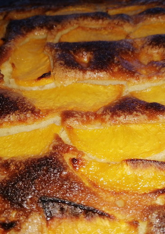Una foto de Bizcocho de melocotón y queso crema