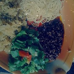 A picture of Rice and beans with chito and salad.