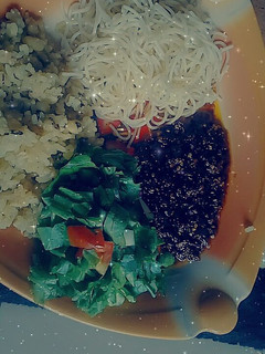 A picture of Rice and beans with chito and salad.