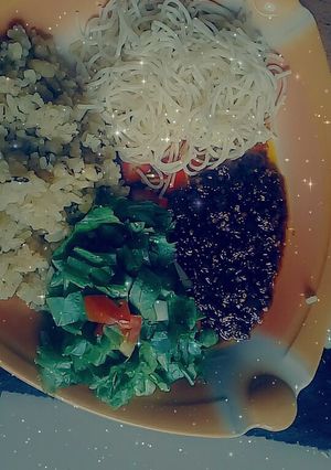 A picture of Rice and beans with chito and salad.