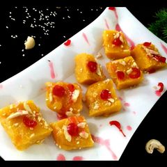 A picture of Orange milk powder barfi.