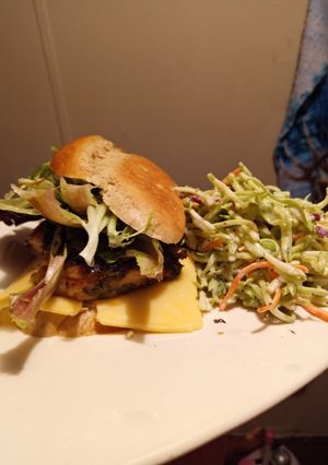 A picture of Grilled Chicken On Rye with Broccoli Slaw.