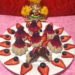 A picture of Strawberry and blueberry Modak.
