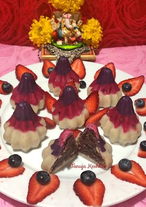 A picture of Strawberry and blueberry Modak.