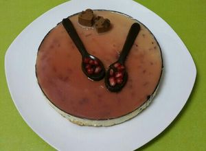Una foto de Mousse de granadas y cobertura de moscatel