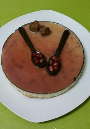 Una foto de Mousse de granadas y cobertura de moscatel