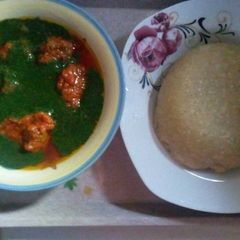 A picture of Stew and ewedu soup.with eba.
