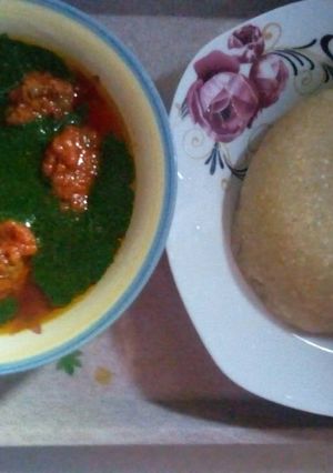 A picture of Stew and ewedu soup.with eba.