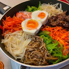 Korean Bibimpab on the party table A picture of Korean Bibimpab on the party table.