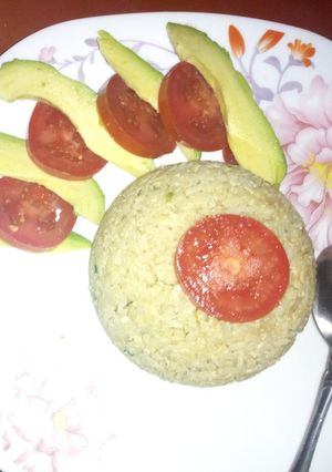 A picture of My special egg rice with ovacado and tomatoes.