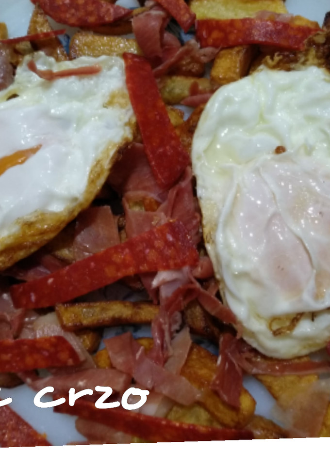 Una foto de Huevos, patatas y jamón