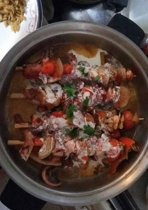 Una foto de Pulpo y el mar en su tinta y quesos