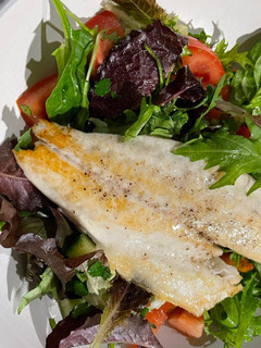 A picture of Pan Fried Sea Bass with a Parsley Salad 🥗.