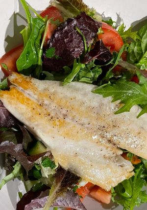 A picture of Pan Fried Sea Bass with a Parsley Salad 🥗.