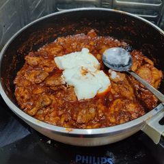 A picture of Chicken Pörkölt (Hungarian paprika stew).