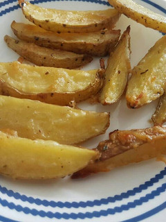 Una foto de Papitas parmesanas con ajo