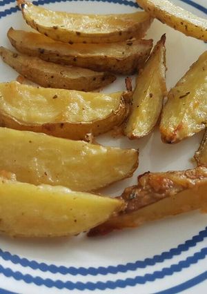 Una foto de Papitas parmesanas con ajo