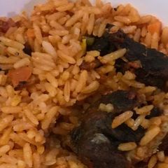 A picture of Jollof rice with beef.
