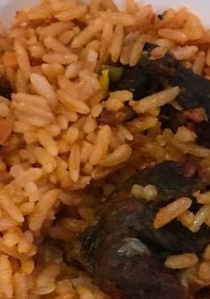 A picture of Jollof rice with beef.