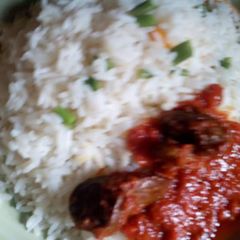 White rice and green peas with stew A picture of White rice and green peas with stew.