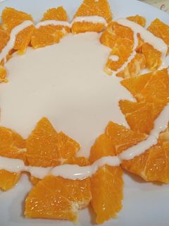 Una foto de Naranja con crema de mascarpone a la vainilla