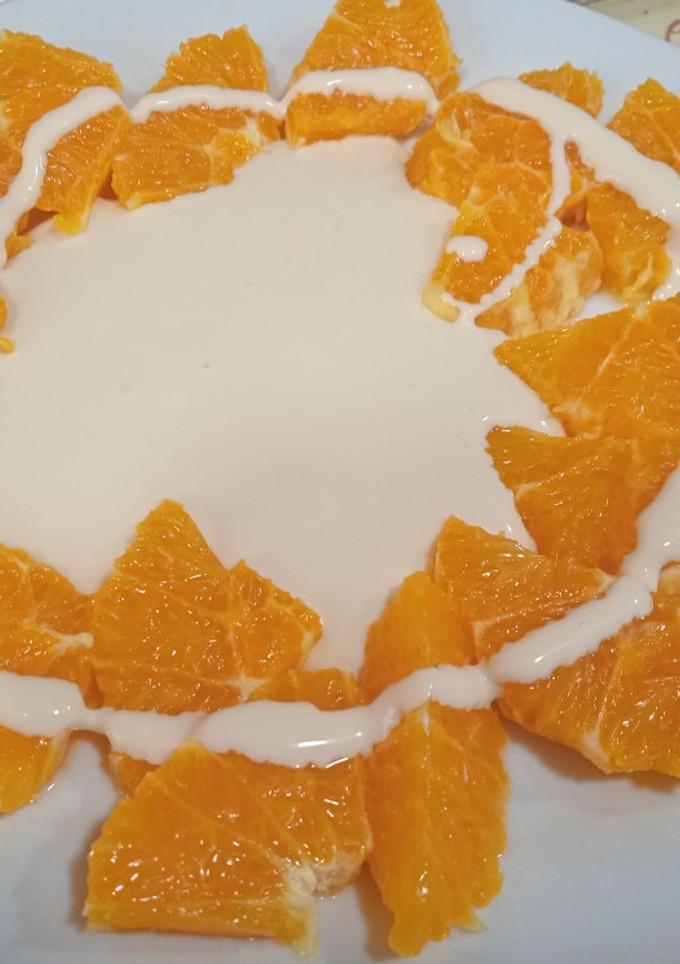 Una foto de Naranja con crema de mascarpone a la vainilla