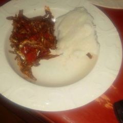 A picture of Dry fried omena (Lake Victoria sardine) with ugali.