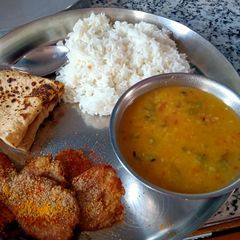 A picture of Dal Rice and Arbi Fry.