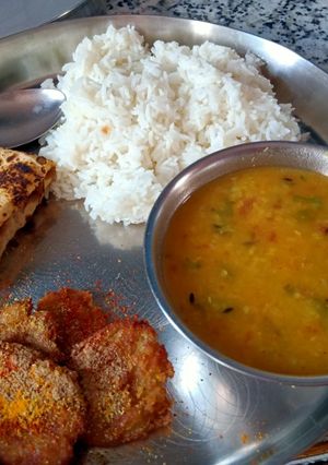 A picture of Dal Rice and Arbi Fry.