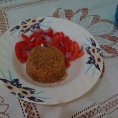 Beef pilau served with kachumbari A picture of Beef pilau served with kachumbari.
