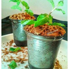A picture of Chocolate pot with chocolate mousse.