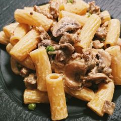 A picture of Creamy Italian sausage, mushroom and pea pasta.