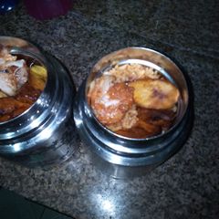 A picture of Jollof rice and dodo.