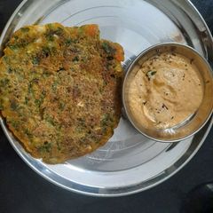 A picture of Palak multigrain cheela and peanut chutney combo.