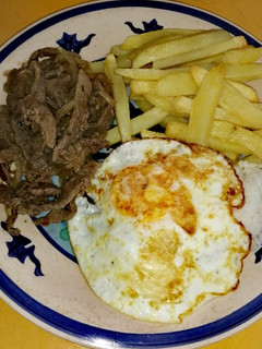 Una foto de Carne Encebollada