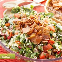 A picture of Bread and vegetables salad with sumac - fattoush.