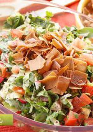 A picture of Bread and vegetables salad with sumac - fattoush.