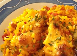 Foto principal de Arroz al Horno con Alitas de Pollo y Secreto Ibérico en Fuente de Barro