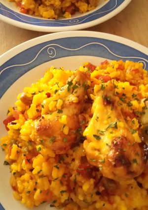Foto principal de Arroz al Horno con Alitas de Pollo y Secreto Ibérico en Fuente de Barro