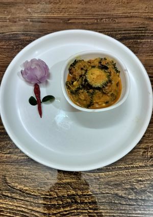 A picture of Kerala style karela masala curry.